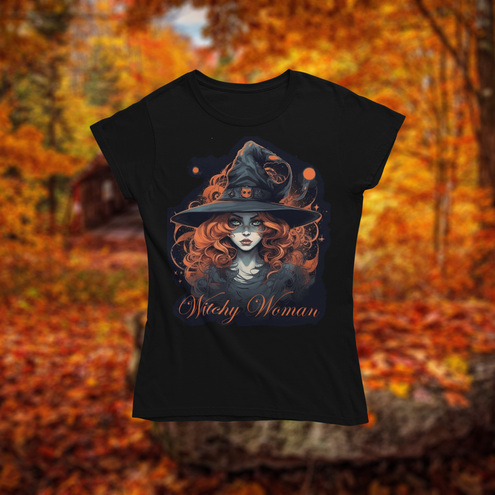 Black t-shirt with a witch graphic and 'Witchy Woman' text on an autumn background